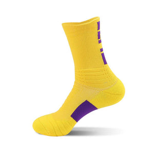 Bright yellow sports sock with purple detailing on the heel and lateral side, against a white backdrop.