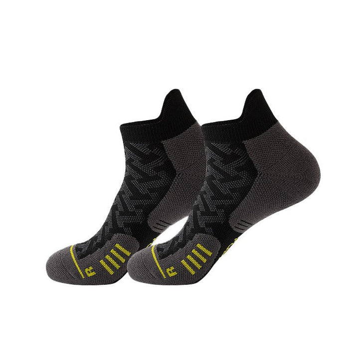 Black and grey ankle socks with yellow accents.