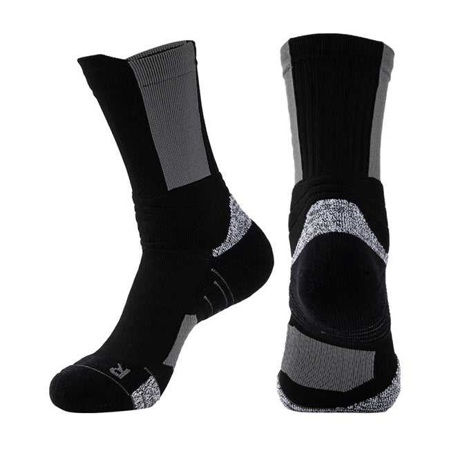 Pair of black basketball socks with grey detailing, padded heels, and compression arch support.