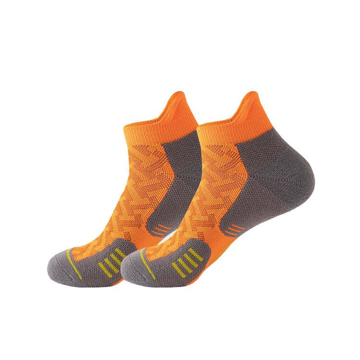 Bright orange ankle socks with grey heel padding and yellow stripes.