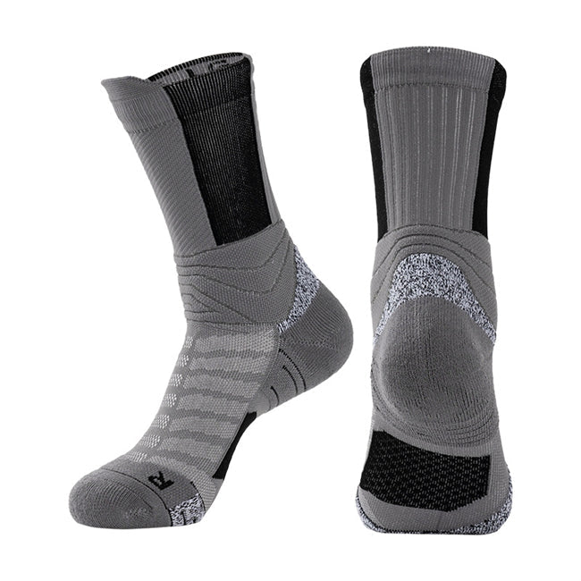 Pair of grey basketball socks with black elastic bands, cushioned soles, and breathable fabric.