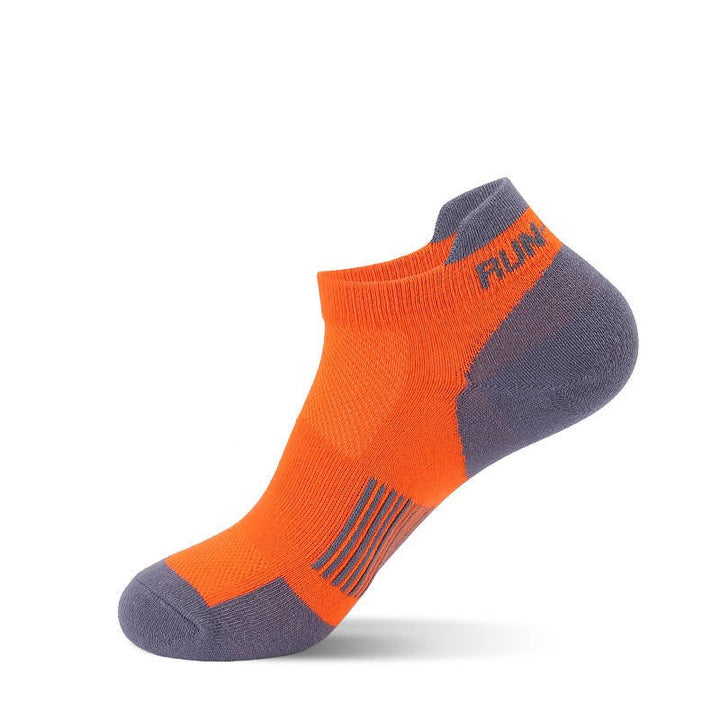 A single orange running sock, on a white background.