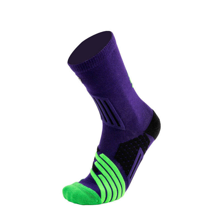 Purple crew sock with vibrant green toe section and black details, isolated on a white background.