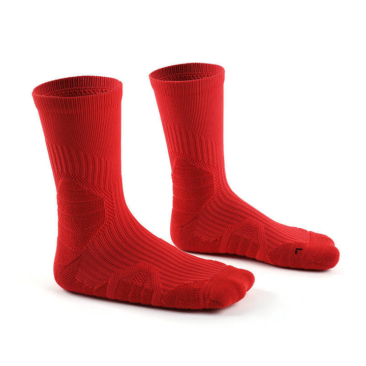 A pair of red knit socks on a white background.