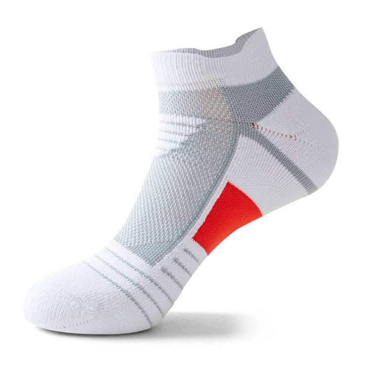 White ankle sock with a white patch on the foot arch, isolated on a white background.