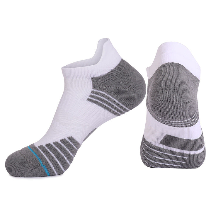 Pair of white and grey basketball socks with blue accents.