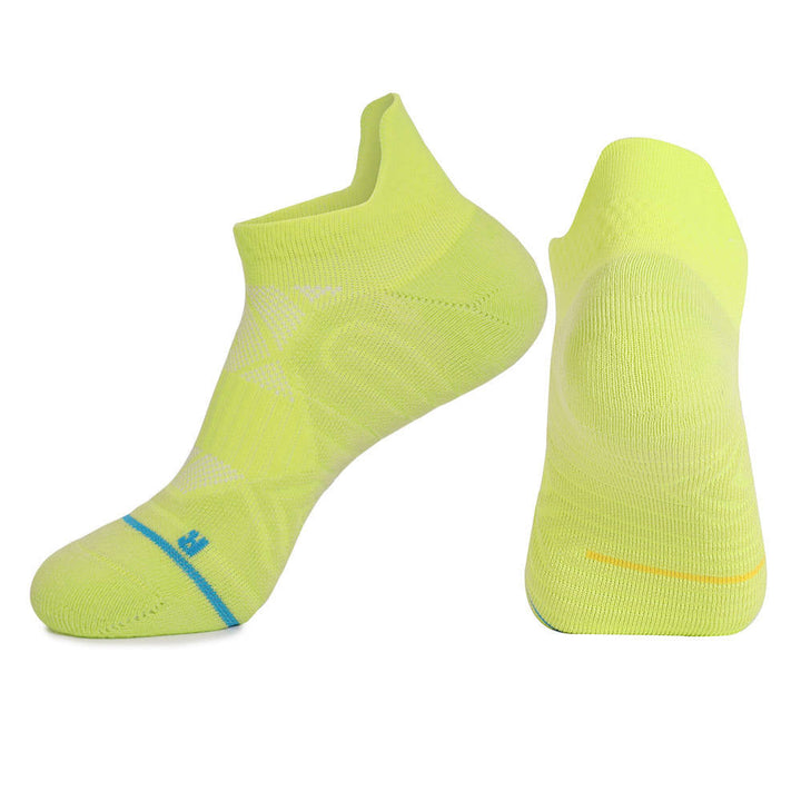 Two yellow sports socks with light blue and yellow accents, one viewed from the side and the other from the bottom.